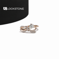 Rose gold pear cut lab grown diamond engagement ring featuring a bow inspired design with pavé diamond split shank