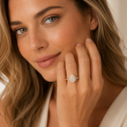 Woman wearing a diamond ring on her hand, close-up of face and hand