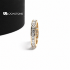 Channel set princess cut diamond wedding ring showcasing a straight line of square stones around a yellow gold band