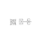 Four metallic brake pads on a white background