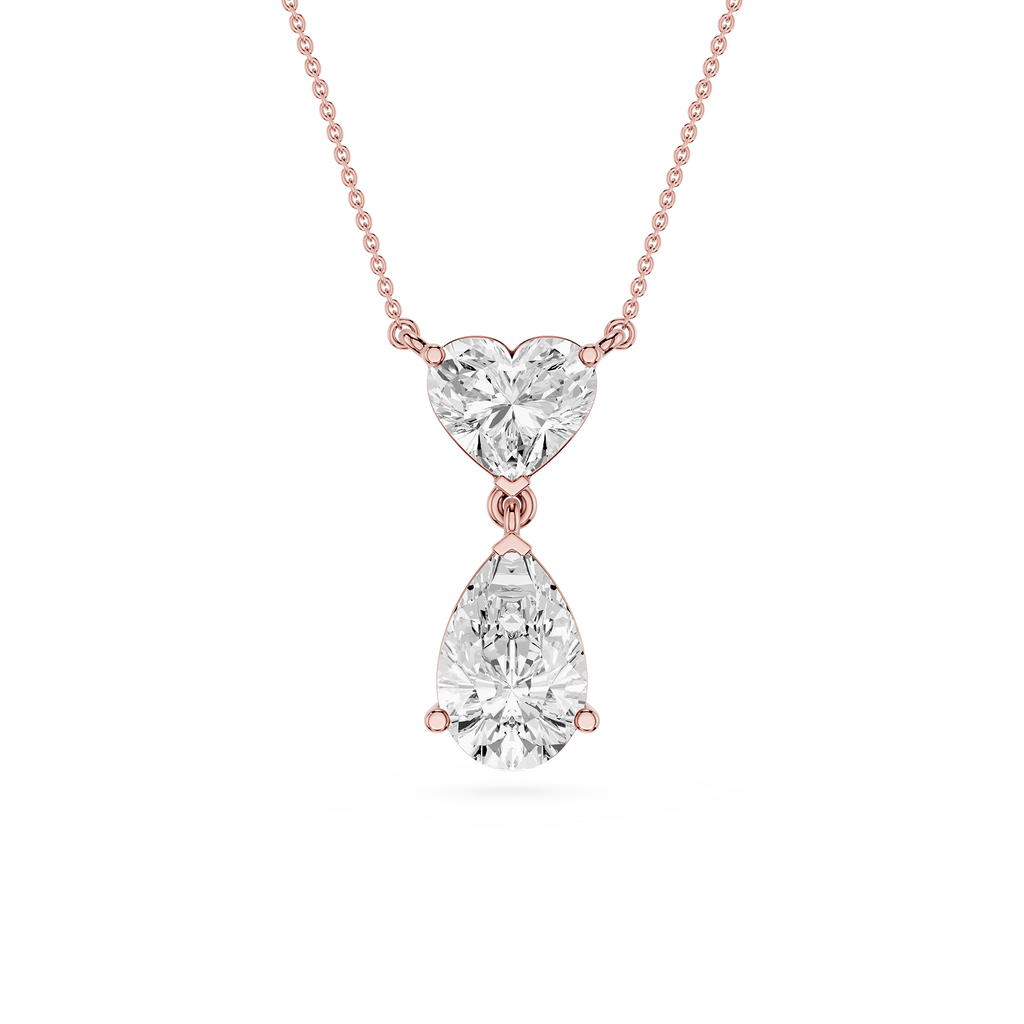 Rose gold necklace with a heart-shaped and teardrop-shaped diamond pendant on a white background