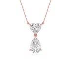 Rose gold necklace with a heart-shaped and teardrop-shaped diamond pendant on a white background