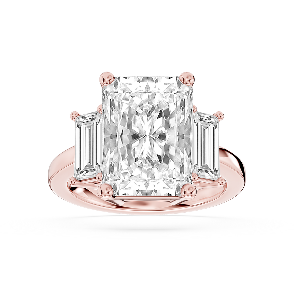 Rose gold radiant cut lab grown diamond engagement ring featuring two tapered baguette accents and a prong set center