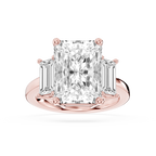Rose gold radiant cut lab grown diamond engagement ring featuring two tapered baguette accents and a prong set center