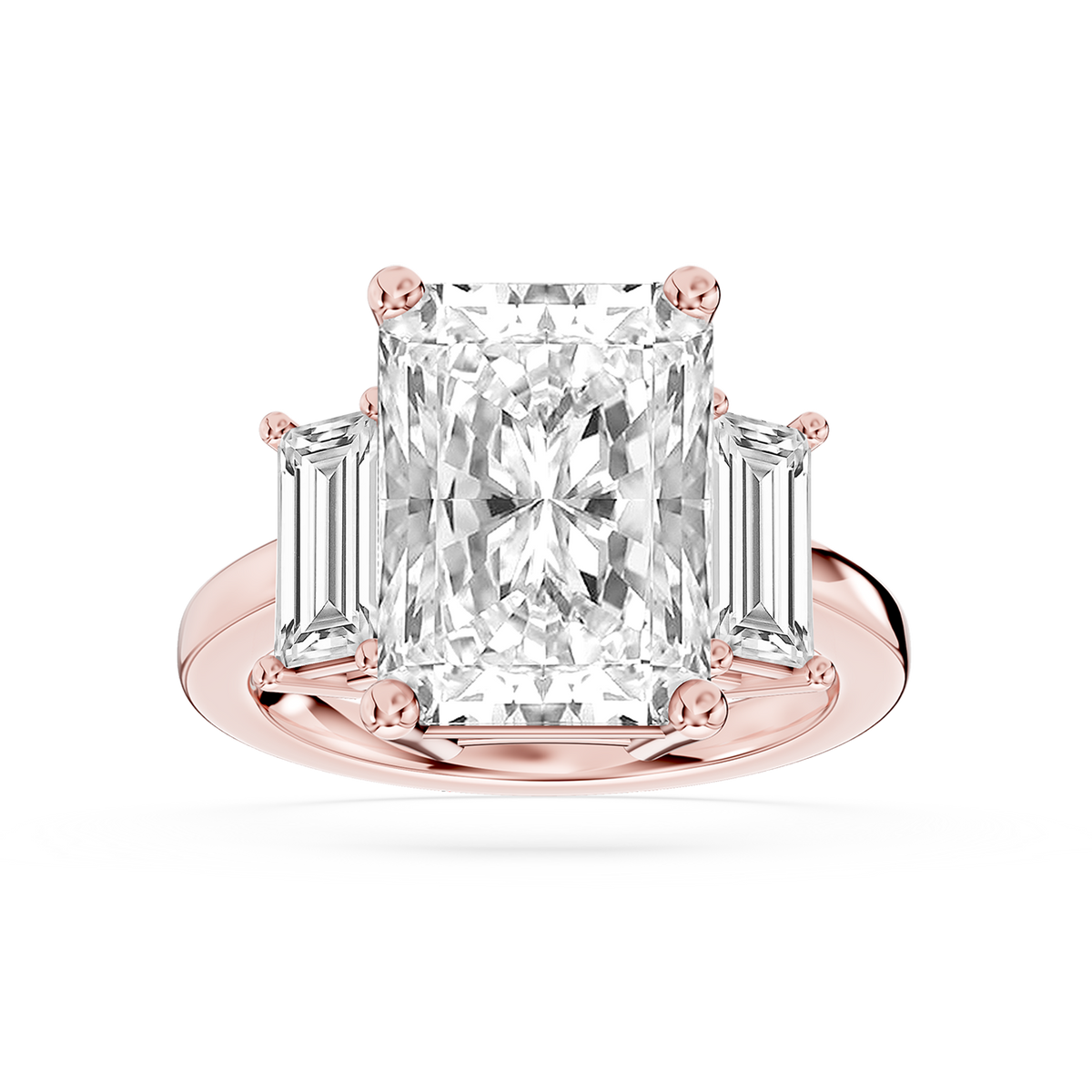 Rose gold radiant cut lab grown diamond engagement ring featuring two tapered baguette accents and a prong set center