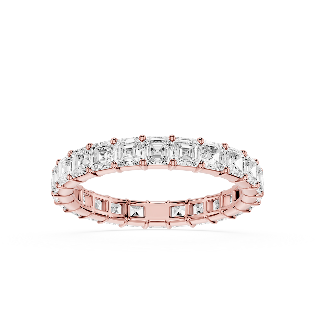 A rose gold eternity ring featuring a continuous row of baguette-cut clear stones, shown on a clean white background.