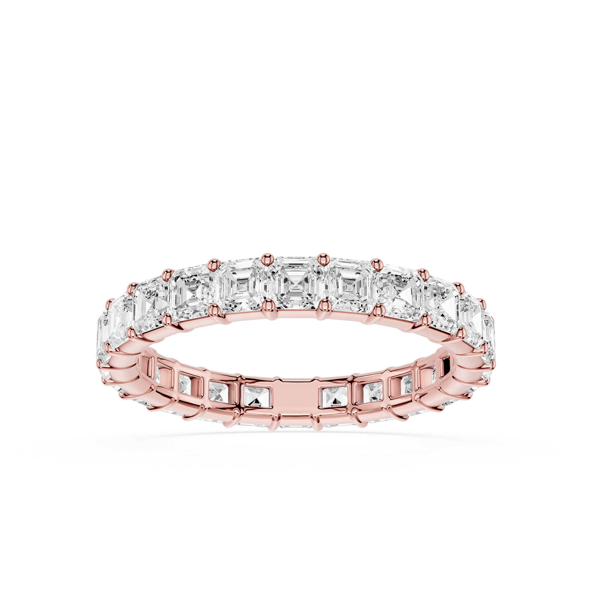 A rose gold eternity ring featuring a continuous row of baguette-cut clear stones, shown on a clean white background.