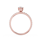 Rose gold ring with diamonds on a white background