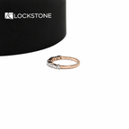 A delicate rose gold stacking ring with rectangular baguette diamonds paired with small round accent stones