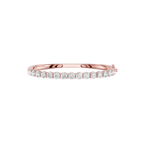 Rose gold ring with diamonds on a white background