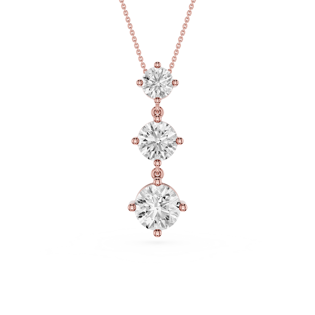 Rose gold necklace with three diamond pendants on a white background