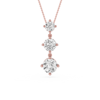 Rose gold necklace with three diamond pendants on a white background