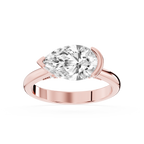 Rose gold east west pear cut lab grown diamond ring showcasing a horizontal solitaire stone and partial bezel setting