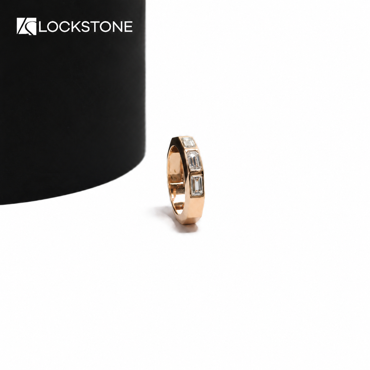 Geometric rose gold diamond statement ring showcasing flush set rectangular step cut stones and beveled metal edges