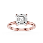 Rose gold ring with a large diamond on a white background