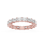 A rose gold eternity ring featuring a continuous line of baguette-cut clear gemstones, shown on a clean white background.