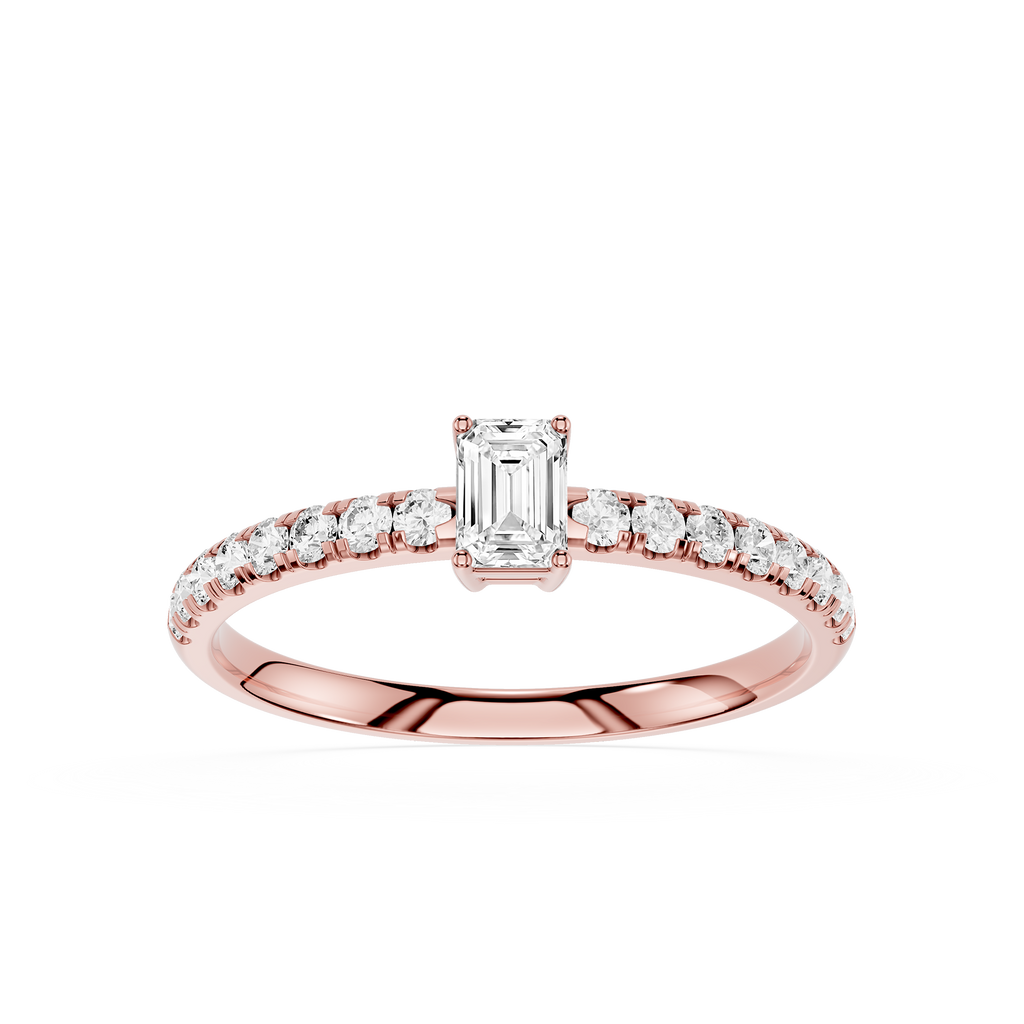 Rose gold ring with emerald-cut diamond and smaller diamonds on a white background