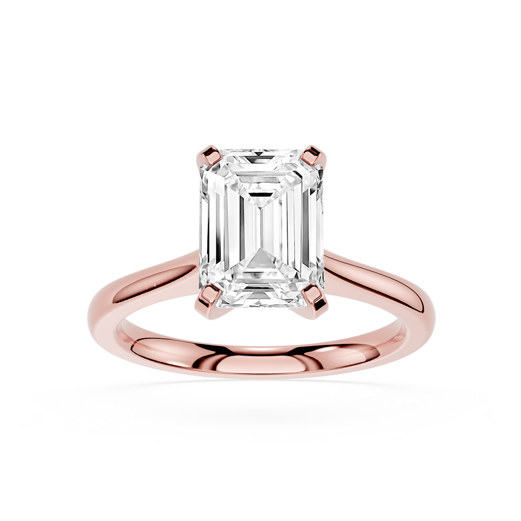 Rose gold ring with a large emerald-cut diamond on a white background