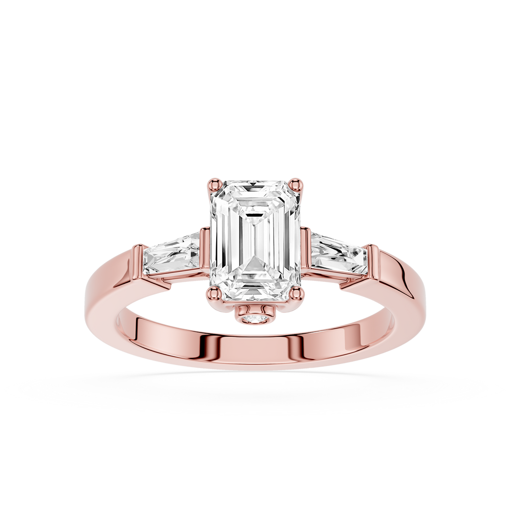 Rose gold ring with emerald-cut diamond and side stones on a white background