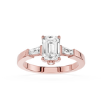 Rose gold ring with emerald-cut diamond and side stones on a white background