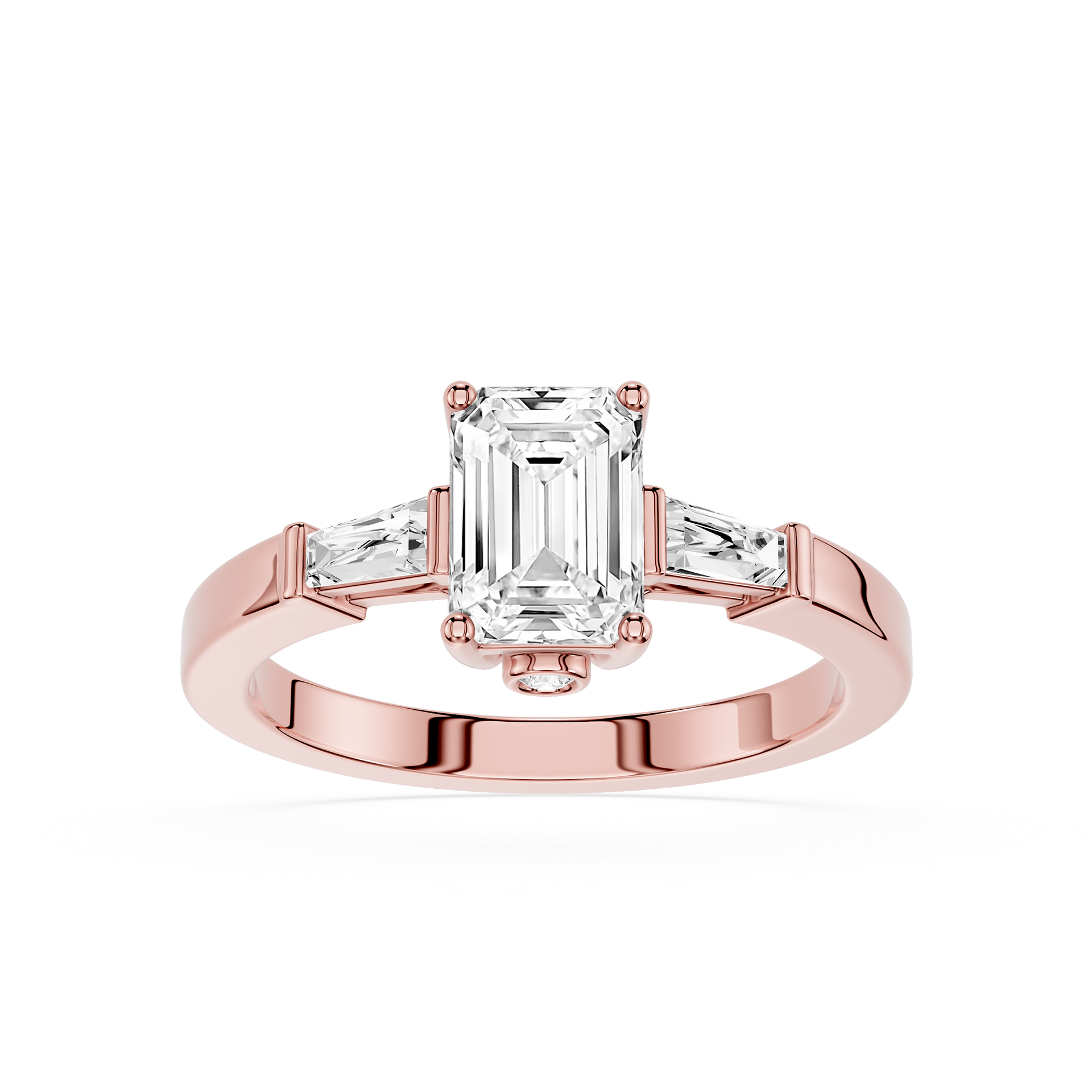Rose gold ring with emerald-cut diamond and side stones on a white background