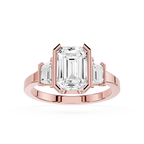 Rose gold ring with emerald-cut diamond on a white background