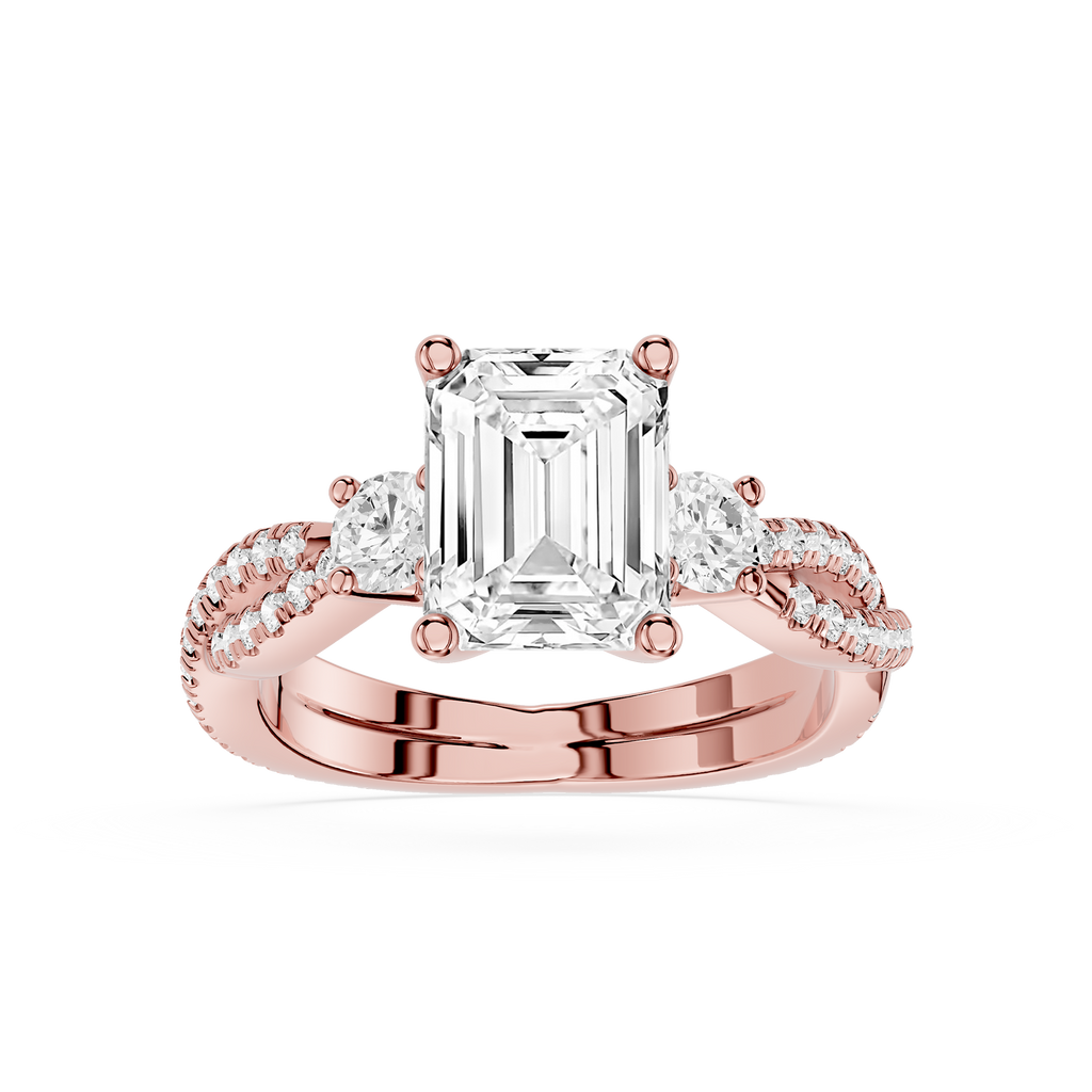 Rose gold ring with emerald-cut diamond and smaller diamonds on a white background