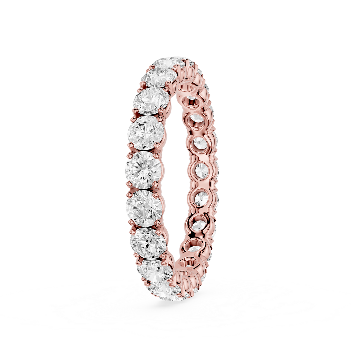 A round brilliant-cut clear diamond rose gold eternity ring with a shared prong setting to grip the stone.