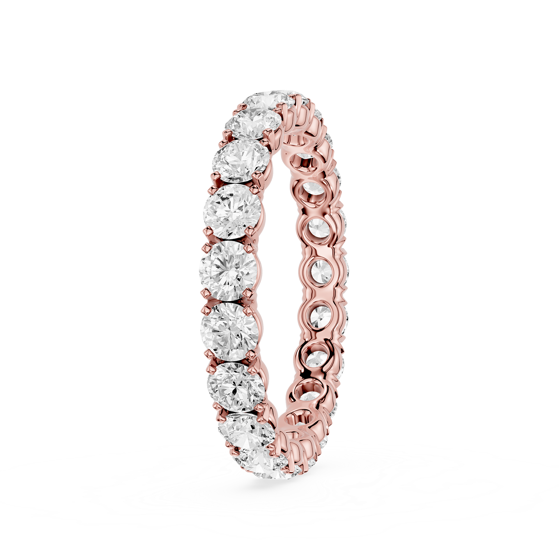 A rose gold eternity ring featuring a continuous row of round brilliant-cut clear diamonds on a white background.