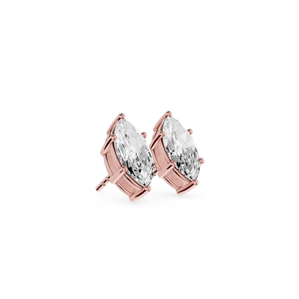 Rose gold earrings with clear gemstones on a white background
