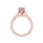 Rose gold ring with a diamond on a white background