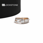 Rose gold oval cut lab grown diamond bypass ring featuring emerald cut side stones and pavé diamond crossover bands