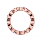 A rose gold ring with a textured, segmented outer edge and a smooth inner band, shown on a clean white background.