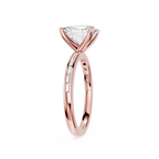 A rose gold engagement ring featuring a triangular clear gemstone in a prong setting, with a polished band accented by small pavé diamonds, shown on a solid white background.