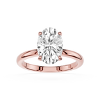 Rose gold ring with a large diamond on a white background