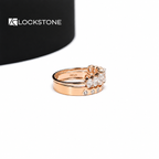 Rose gold oval diamond bridal ring set featuring prong set center stones and a matching band with spaced bezel diamonds