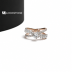 Rose gold lab grown diamond bypass ring featuring an oval center stone, marquise side diamonds and pavé split shank