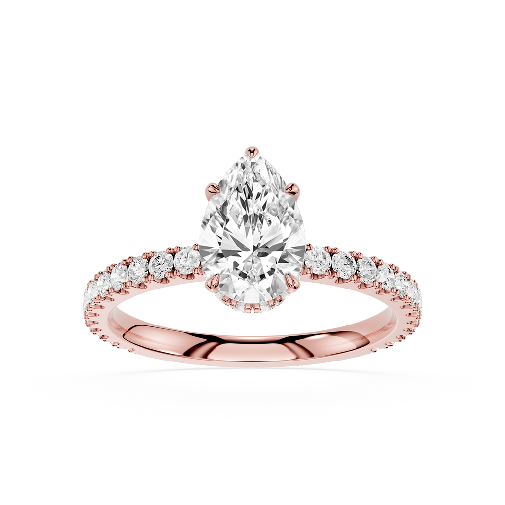 Rose gold ring with a pear-shaped diamond on a white background