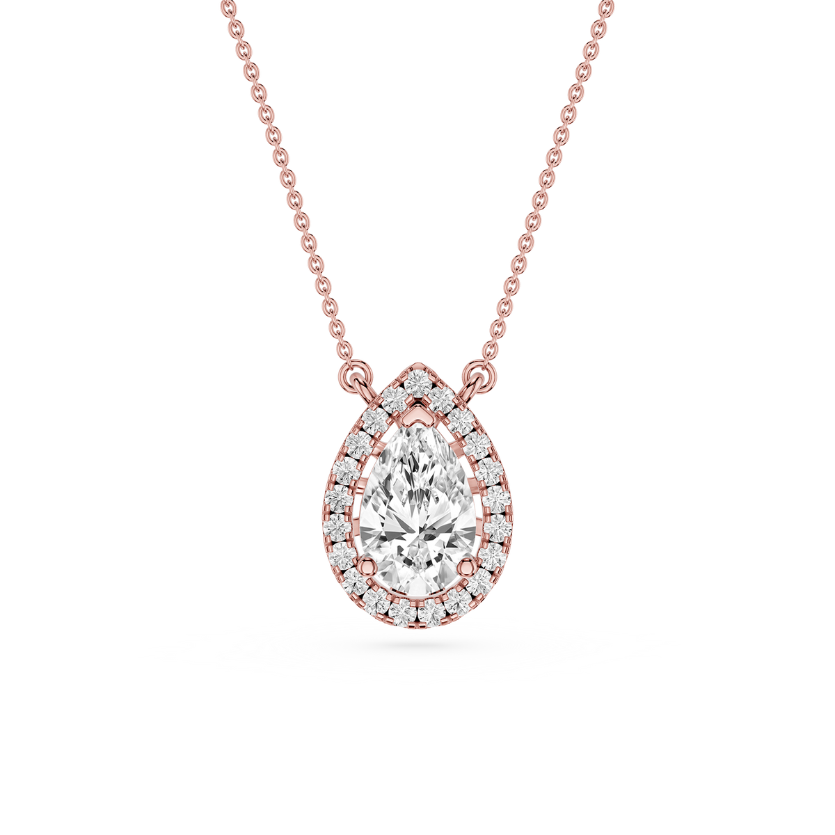 Rose gold pear cut lab grown diamond pendant featuring a 1.2 carat center diamond outlined by round halo stones
