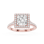 Rose gold ring with a large diamond and smaller diamonds on the band against a white background