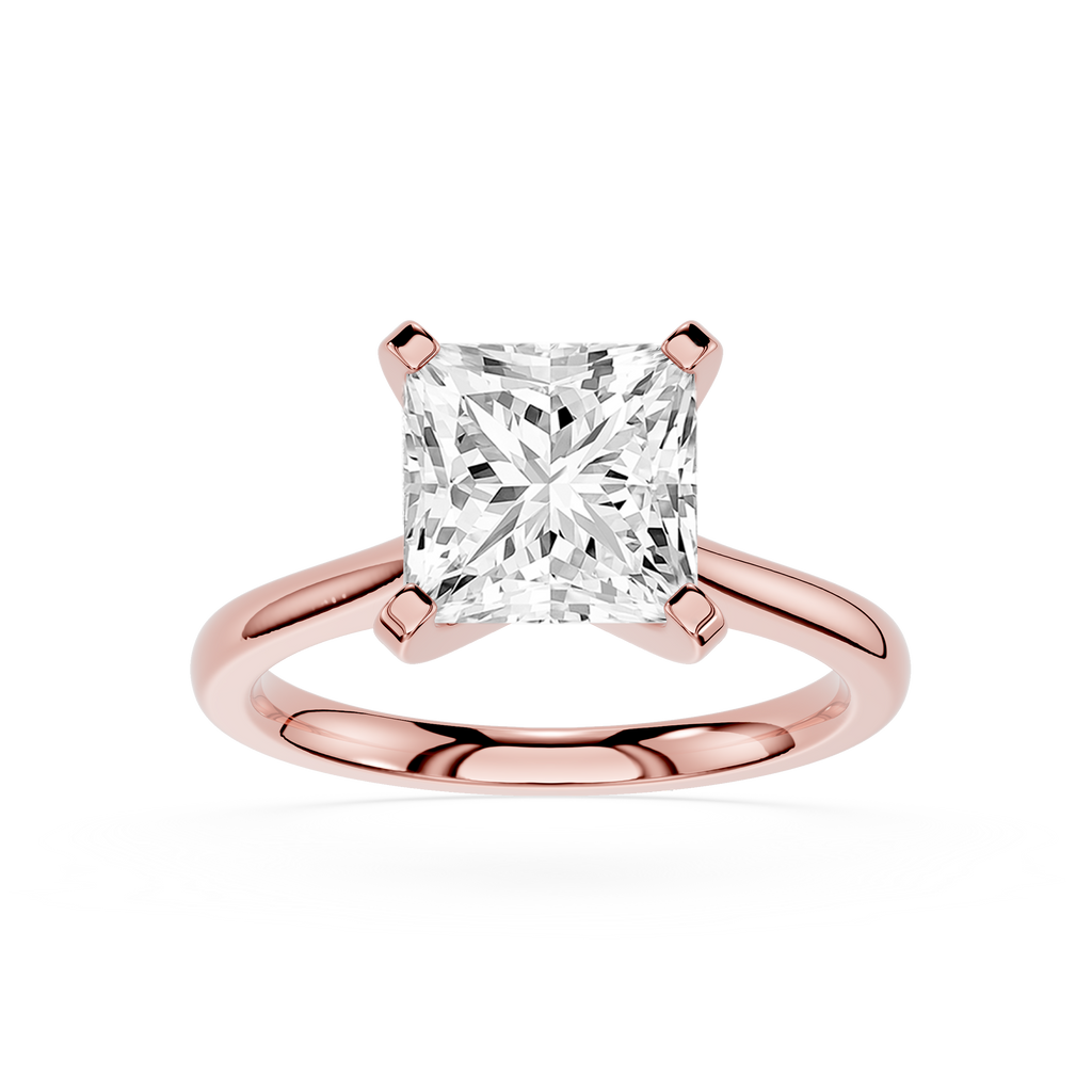 Rose gold ring with a large diamond on a white background