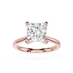 Rose gold ring with a large diamond on a white background