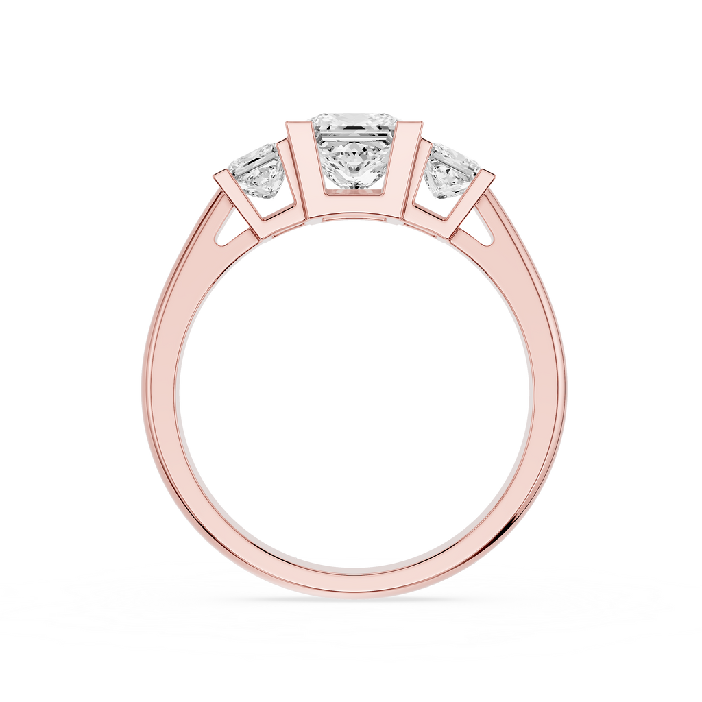 Rose gold ring with three diamonds on a white background