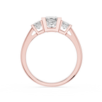 Rose gold ring with three diamonds on a white background