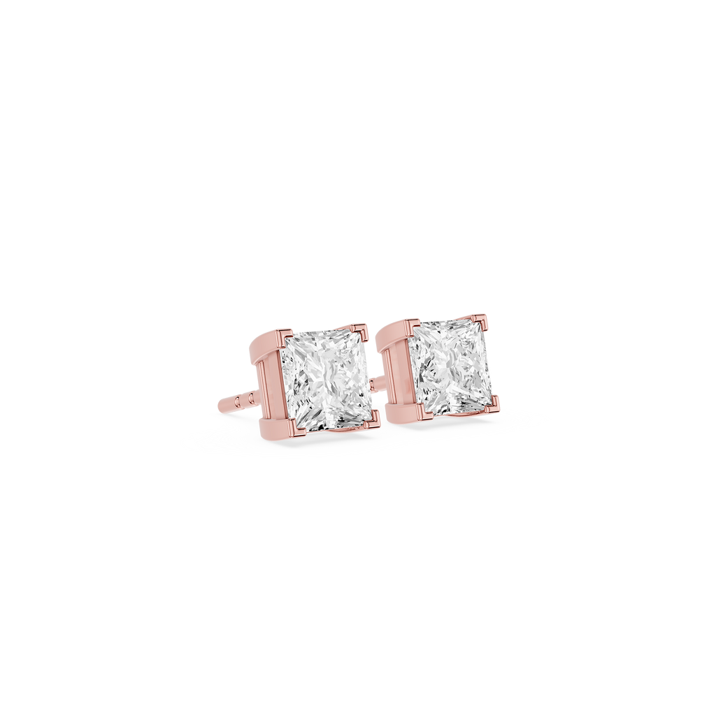 Rose gold stud earrings with clear gemstones on a white background