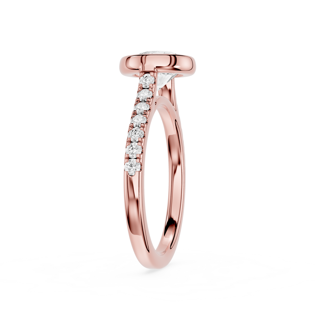 A rose gold diamond ring with a pavé band featuring a row of clear round-cut diamonds and a triangular diamond accent, set against a plain white background.