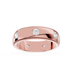 Rose gold ring with embedded diamonds on a white background