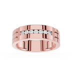 Rose gold ring with embedded diamonds on a white background