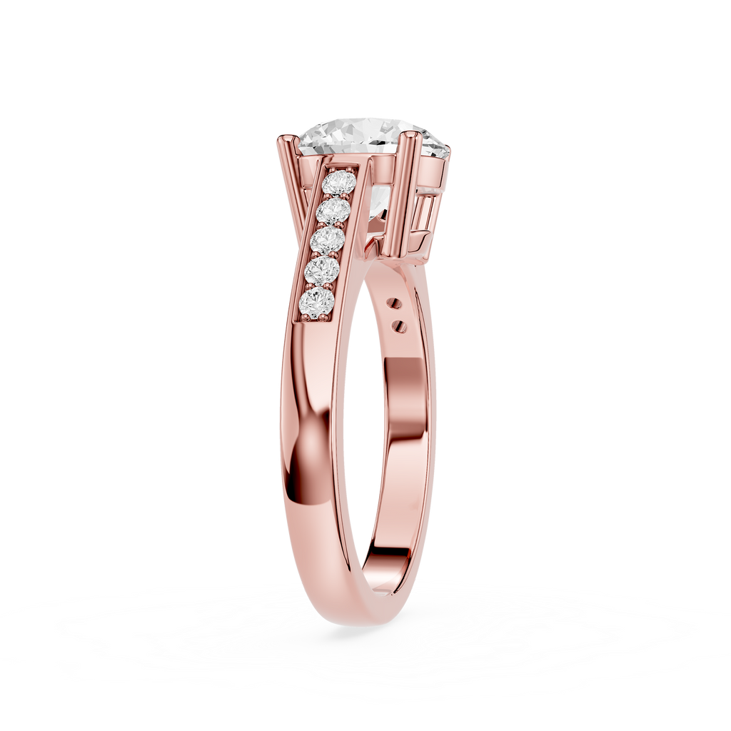 A rose gold engagement ring featuring a round brilliant-cut center stone and a pavé row of small round stones on the shank, shown on a clean white background.