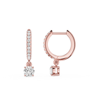 Rose gold hoop earrings with diamond accents on a white background